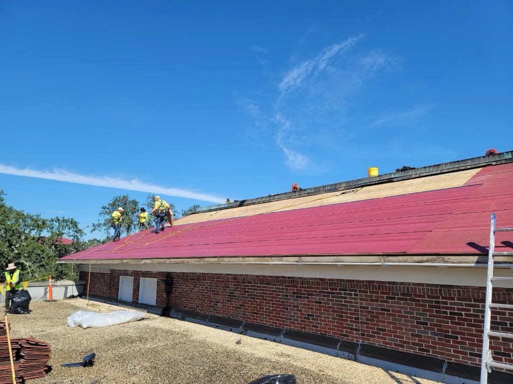 Roofer completing installation